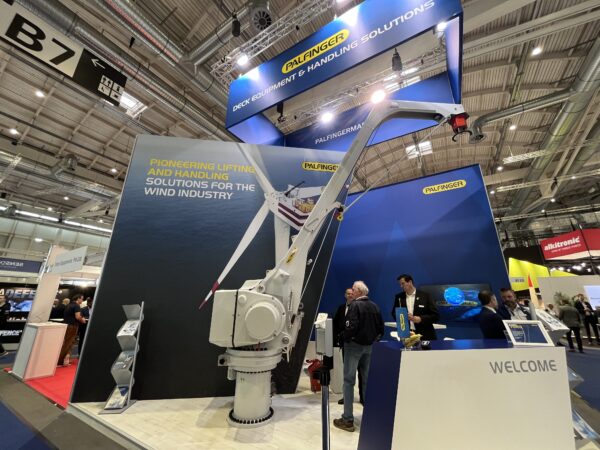 PALFINGER MARINE trade show stand equipped with a model of the redesigned PALFINGER fixed boom crane.