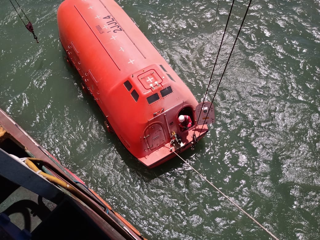 Lifeboat launched into water and serviced by a technician